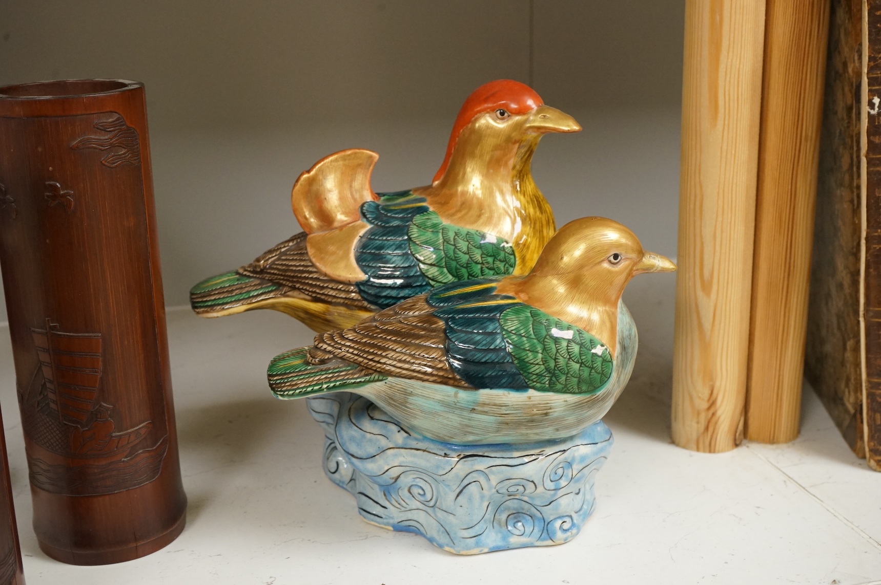 A Chinese Revolution Period porcelain bird group, 21.5cm, a pair of Chinese bamboo brushpots carved with figures and junks, each 22cm high, and a Japanese Seto blue and white vase, 29cm high